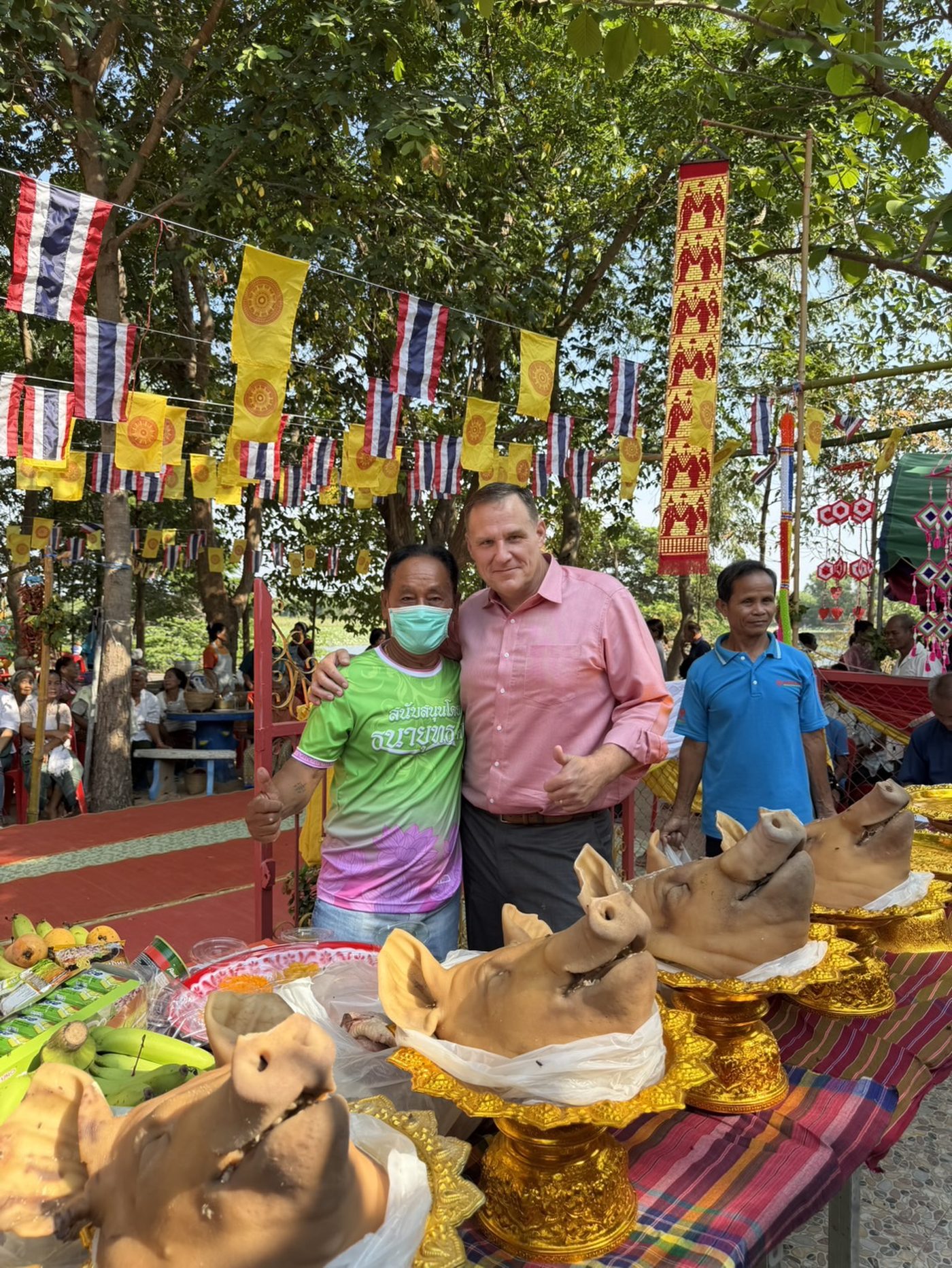 Benjamin Cunningham with a local vendor at a village festival in Surin Province, Thailand